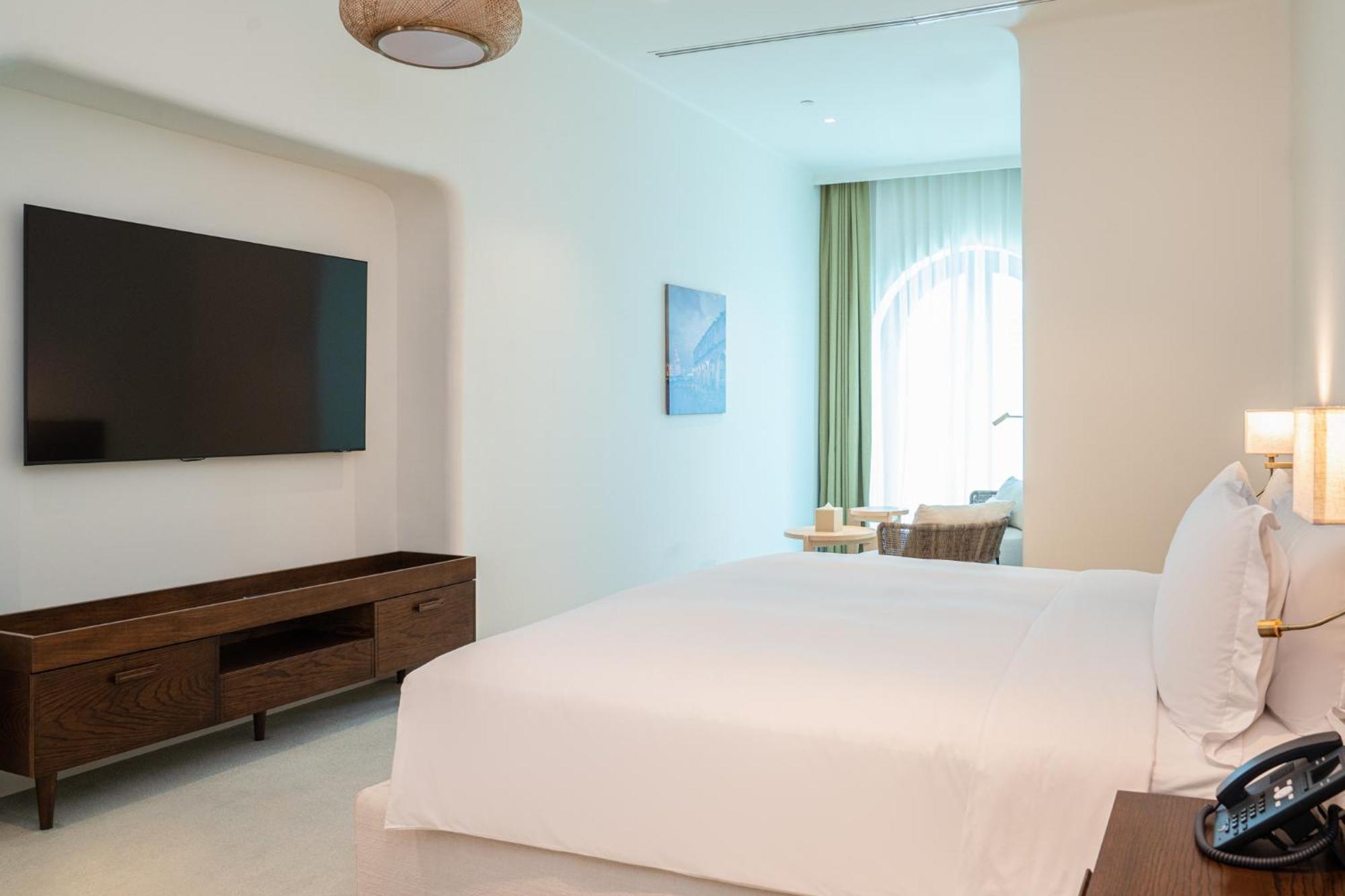 Mina Hotel And Residences By The Torch Doha Luaran gambar A bedroom at the hotel